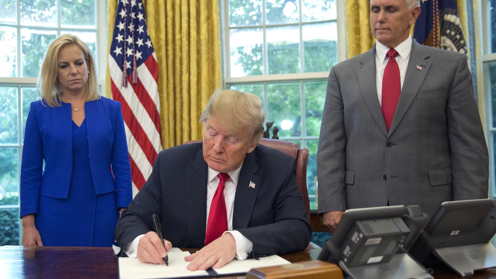 In reversal, Trump signs order stopping family separations